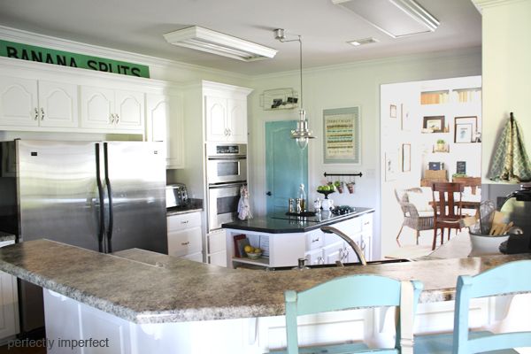 kitchen decor on a budget.  using vintage signs in your kitchen decor.